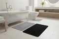 Black and grey bath mat set